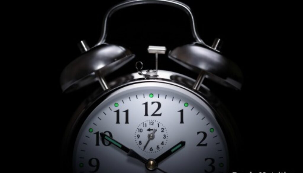 Alarm clock in the middle of the night isolated on black concept for insomnia