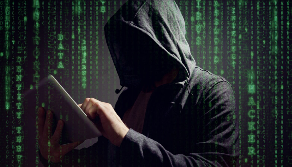 Computer hacker with digital tablet stealing data concept for ne