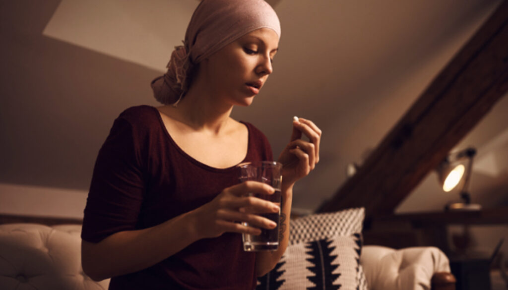 Woman-suffering-from-cancer-taking-medicine-1