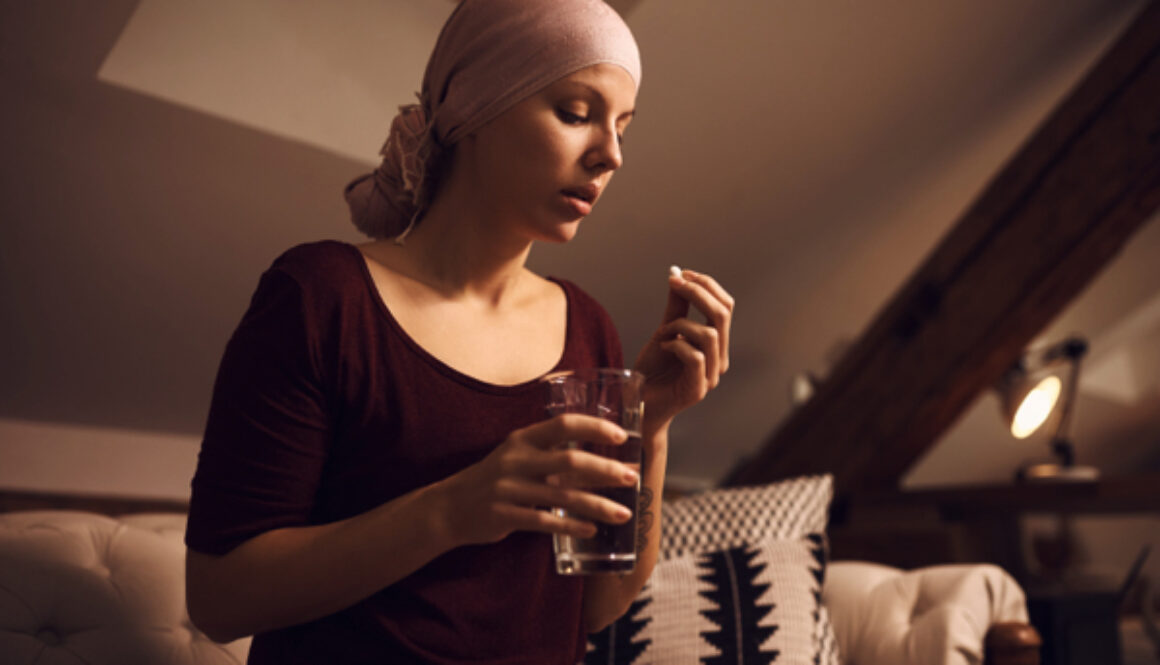 Woman-suffering-from-cancer-taking-medicine-1