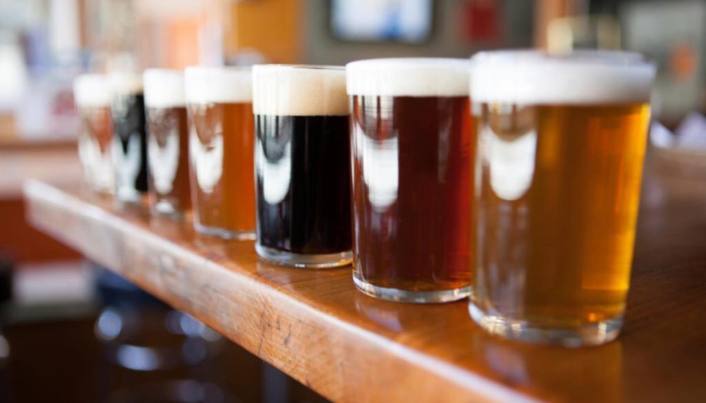 Row-Of-Beer-Tasters-Lined-Up-In-A-Brewpub