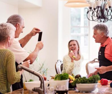 Elderly-Friends-Dinner-Party-Singing-Fun