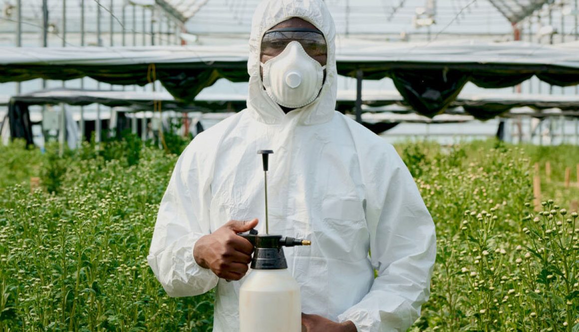 101725_Greenhouse_Worker_Wearing_Protective_Suit