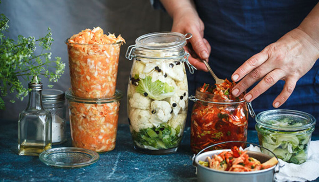 Canning fermented food in jars prep hand sauerkrauft kimchi bro